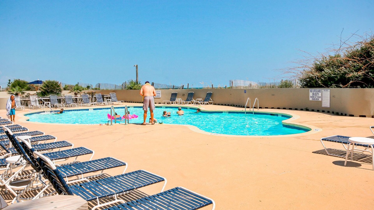 14th-floor condo steps from beach with balcony, ocean views, pools, & hot tub