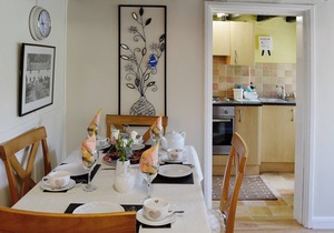 A cosy cottage for four with a wood burner and large, shared garden.