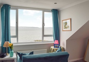 A spacious apartment with stunning views over Gare Loch.