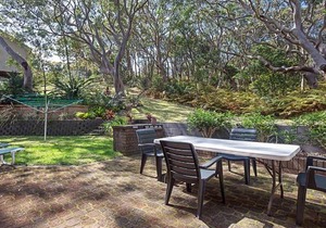 Adriana 3 unit with a backyard