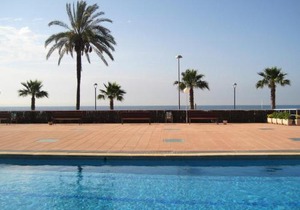 AT116 Els Pins, comunidad con piscina en 1ra línea de la playa