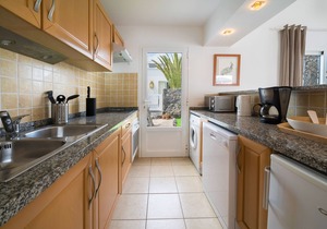 B1, in a small complex with communal heated pool 100m from the sea