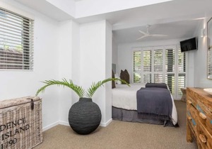 Beautifully designed 4 bedroom, 4 bathroom home right across the road from beach