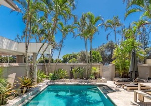 Beautifully designed 4 bedroom, 4 bathroom home right across the road from beach