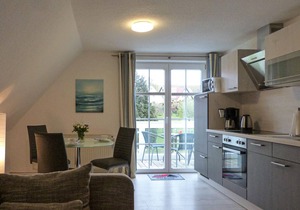 "Between the Baltic Sea beach and the Bodden, the Boddenhus apartment house awaits you with its brig