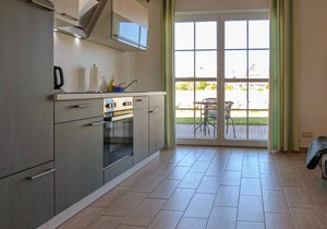 "Between the Baltic Sea beach and the Bodden, the Boddenhus apartment house awaits you with its brig