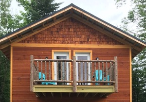 Brand New Beach Front Cottage, located on 4th Lake, walking distance to town.