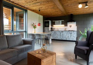 Bungalow with decorative fireplace on farm