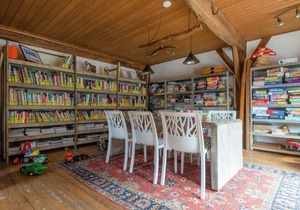 Bungalow with decorative fireplace on farm