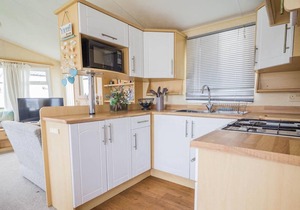 Caravan with decking and free WiFi at Seawick Holiday Park ref 27359S