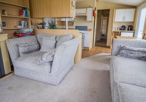 Caravan with decking and free WiFi at Seawick Holiday Park ref 27359S