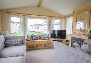 Caravan with decking and free WiFi at Seawick Holiday Park ref 27359S