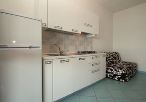 Casa Panna A: A cheerful apartment that is part of a small villa located right on the beach, with Free WI-FI.