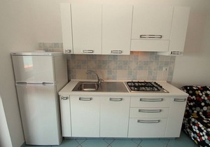 Casa Panna A: A cheerful apartment that is part of a small villa located right on the beach, with Free WI-FI.