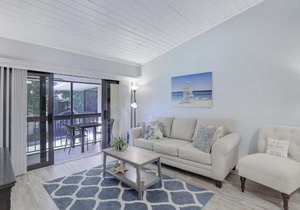 Charming condo with two pools and steps to beach