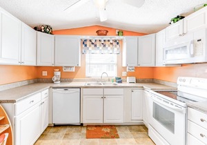 Charming waterfront house with heated pool, hot tub, & W/D - snowbird-friendly