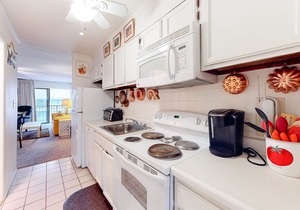 Condo Steps from the Beach w/Balcony, Partial Ocean View, AC & Shared Pool