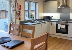 Contemporary lodge with one master double with flatscreen TV and en suite shower/W.