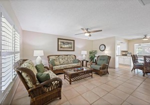 Cozy home with sunroom, pool and steps to beach