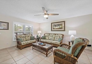 Cozy home with sunroom, pool and steps to beach