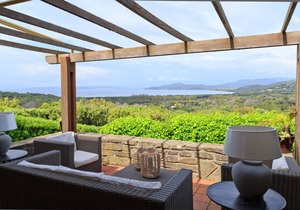 Designer villa with splendid bay view of Punta Ala, two terraces and garden.