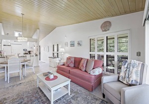 End unit condo w/two pools and steps to beach
