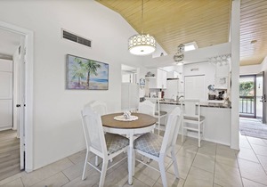 End unit condo w/two pools and steps to beach