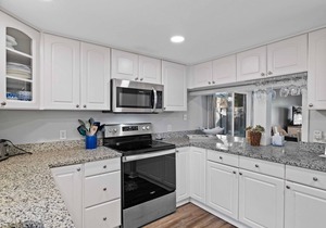 Enjoy a walk to the beach from this renovated, pet friendly end-unit villa.