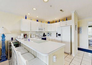 Family-friendly condo with beach access, pools, covered deck, W/D & AC
