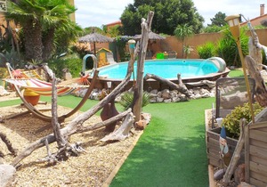 Gite saint julien in rez of garden with terrace swimming pool and games.