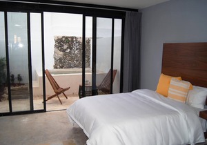 Habitación con 2 camas matrimoniales y alberca privada en el centro de Mérida.
