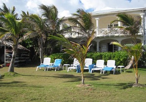 Inchcape Seaside Villas right on Silver Sands Beach - House Sunset downstairs