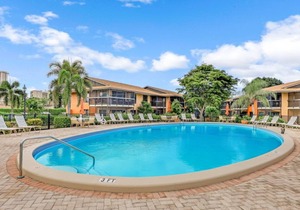 Island-style condo w/ two heated pools & brief walk to beach