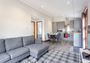 Luxurious lodge with one double bedroom and one twin bedroom.