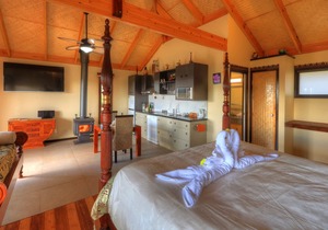 Luxury self-contained villa with double bed, double spa, fireplace, and kitchen.