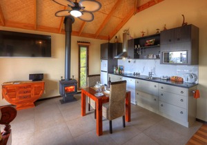 Luxury self-contained villa with double bed, double spa, fireplace, and kitchen.