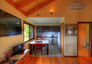 Luxury self-contained villa with king bed, double spa, fireplace, and kitchen.