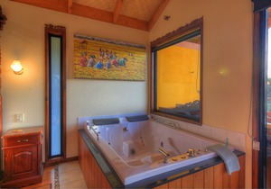 Luxury self-contained villa with king bed, double spa, fireplace, and kitchen.