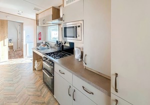 Modern and contemporary 12ft-wide caravan with two twin.