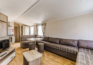 Modern and contemporary 12ft-wide caravan with one double and one twin.