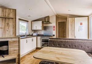 Modern and contemporary 12ft-wide caravan with one double and one twin.