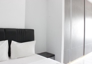 Modern & Spacious 1BR at Mekarwangi Square Apartment By Travelio