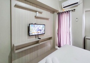 New Furnished & Modern @ Studio Tamansari Mahogany Karawang Apartment By Travelio