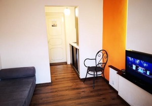 Orange studio with balcony