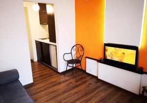 Orange studio with balcony