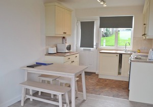 Part of a small terrace of bungalows with uninterrupted views towards the sea.