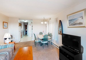 Partial Ocean View Condo in Oceanfront Building with Balcony, WiFi & Laundry