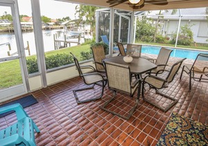 Peaceful, spacious canal-front home w. private screened-in pool