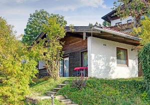 Quaint Chalet with Garden Terrace Fireplace Play Equipment