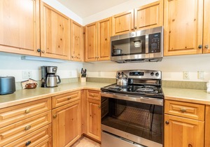 River Run Condo with Spacial Balcony overlooking Ice Rink & Mountain Views!